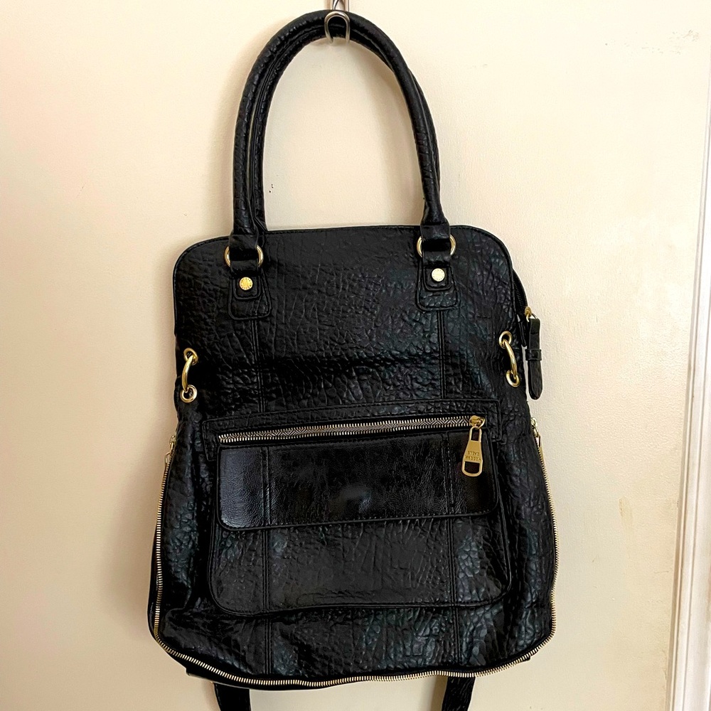 Never used black textured Steve Madden purse. Adjustable straps.